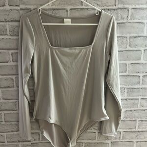 H&M gray body suit - no size printed. Roughly size 12